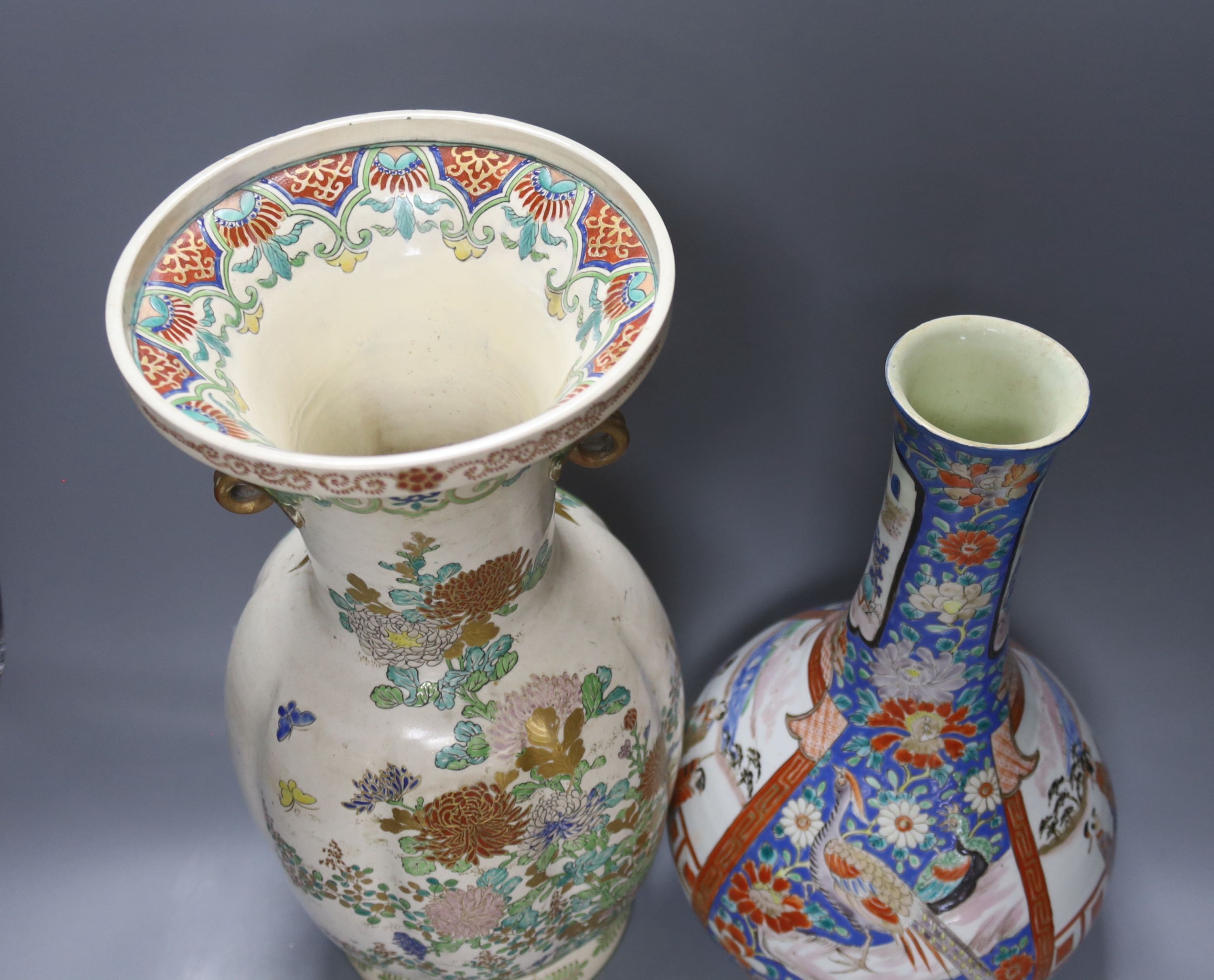 A Japanese porcelain bottle vase and a large Satsuma pottery vase (restoration) 39cm (2)